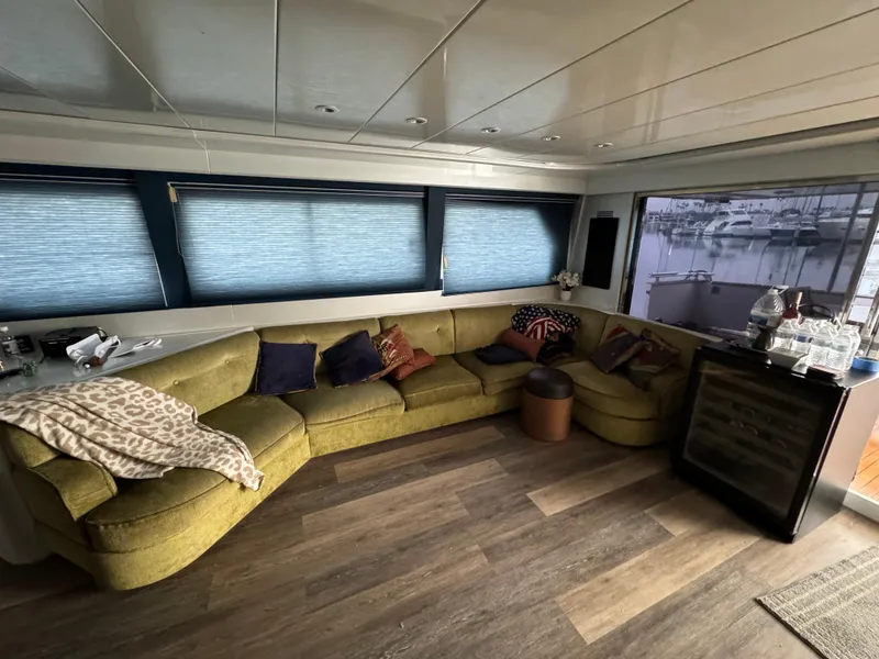 Slide: The Image of Luxurious interior of 1990 Versilcraft Challenger Motor Yacht with cozy seating and scenic window view. - 16