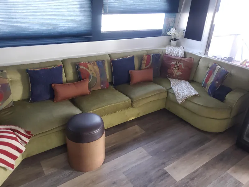 Slide: The Image of Luxurious interior of 1990 Versilcraft Challenger Motor Yacht with plush seating and decorative cushions. - 17