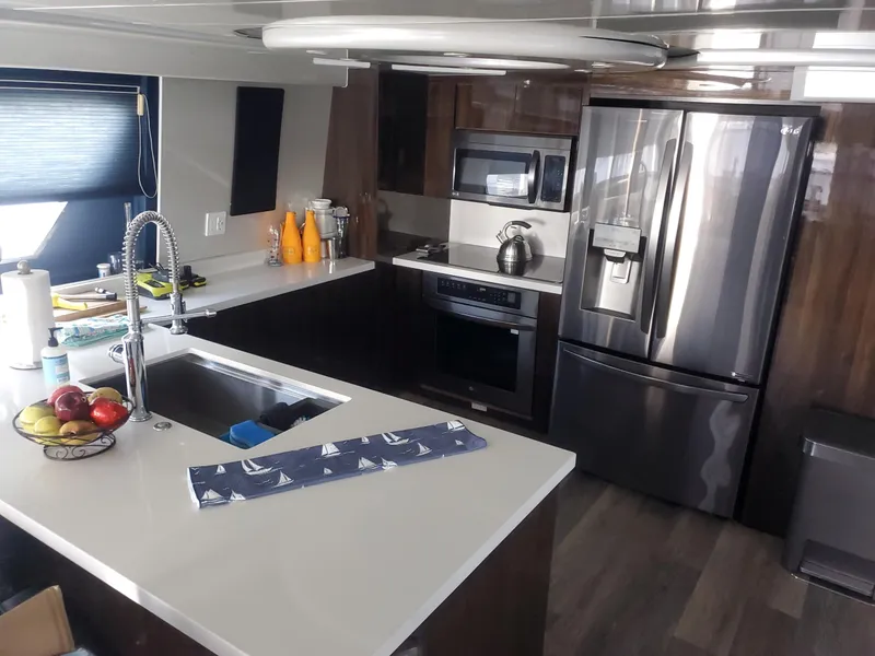 Slide: The Image of Modern kitchen interior of 1990 Versilcraft Challenger Motor Yacht with stainless steel appliances. - 20