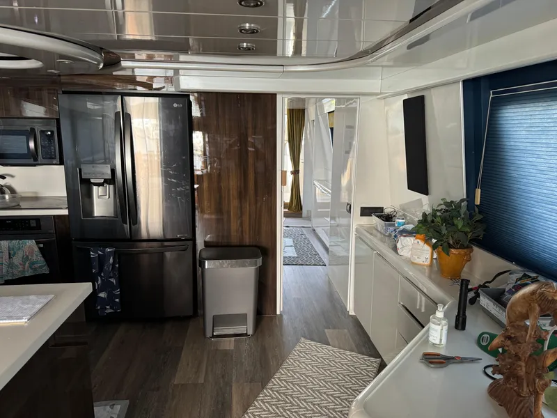 Slide: The Image of Interior of 1990 Versilcraft Challenger Motor Yacht with modern kitchen amenities. - 21