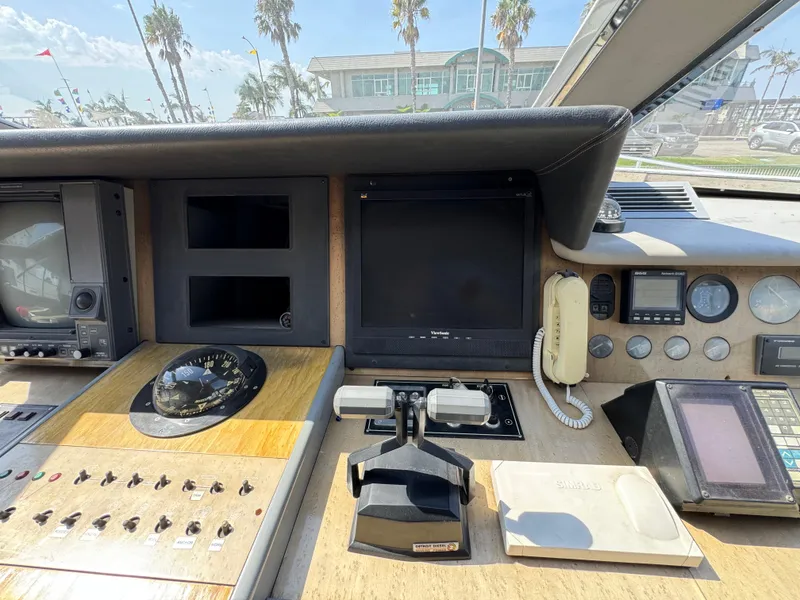 Slide: The Image of Control panel of a 1990 Versilcraft Challenger Motor Yacht with navigation instruments. - 25