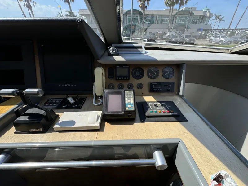 Slide: The Image of Control panel of a 1990 Versilcraft Challenger Motor Yacht with navigation instruments. - 26