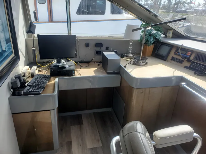 Slide: The Image of Control room of a 1990 Versilcraft Challenger Motor Yacht with computer and navigation equipment. - 27