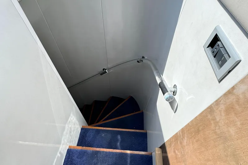 Slide: The Image of Staircase with blue carpet on 1990 Versilcraft Challenger Motor Yacht. - 34