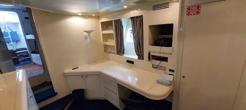 Slide: The Image of Interior of 1990 Versilcraft Challenger Motor Yacht with desk and shelving. - 40