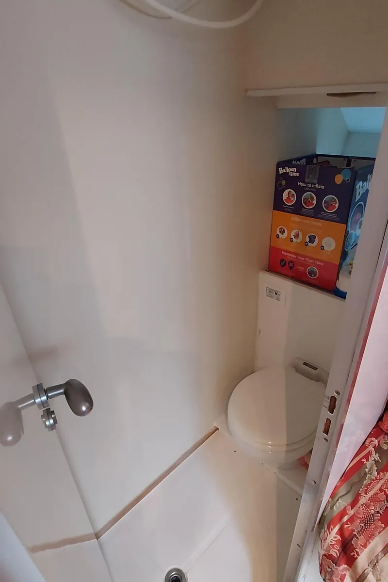 Slide: The Image of Compact bathroom in 1990 Versilcraft Challenger Motor Yacht with shower and toilet. - 45