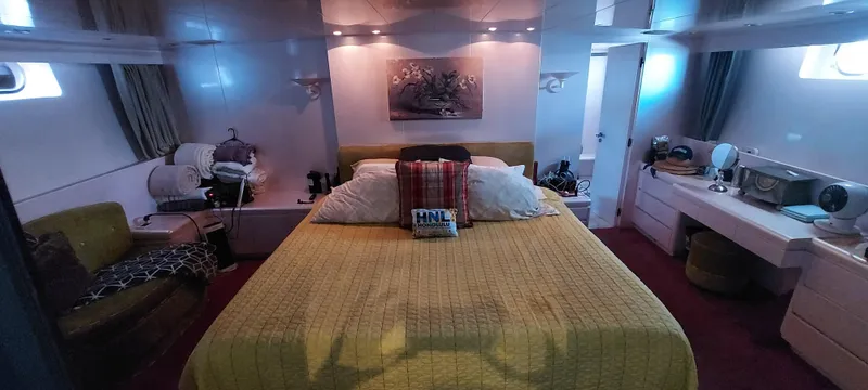 Slide: The Image of Luxurious bedroom interior of 1990 Versilcraft Challenger Motor Yacht with elegant decor and cozy ambiance. - 48