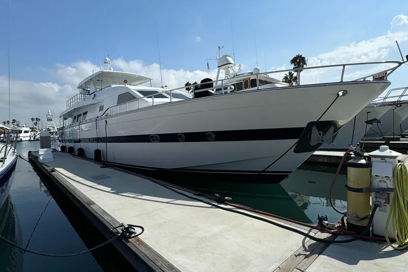 Slide: The Image of 1990 Versilcraft Challenger Motor Yacht docked at marina under clear sky. - 5