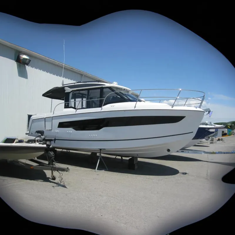 The Image of 2026 Jeanneau NC 895 Series 2 boat displayed indoors on stands. - 0