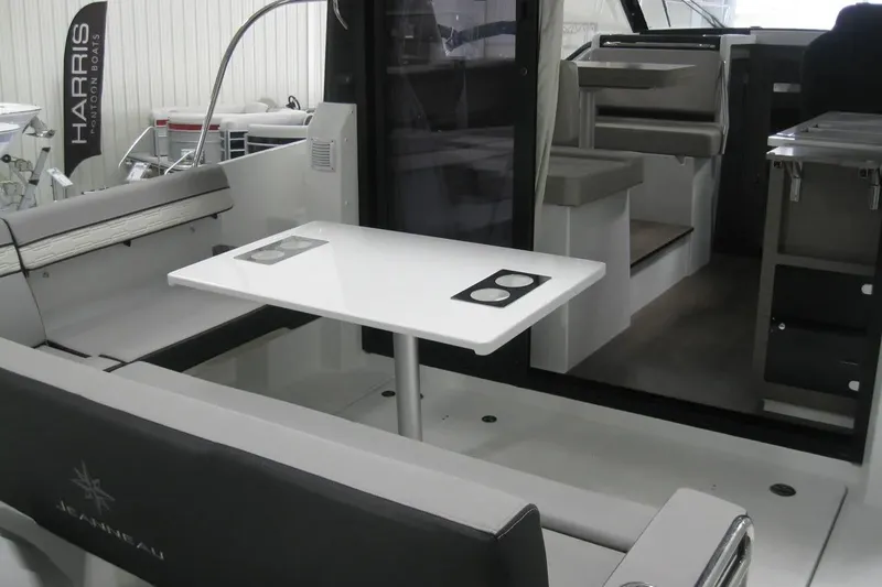 Slide: The Image of 2026 Jeanneau NC 895 Series 2 boat interior with sleek white deck and seating area. - 12