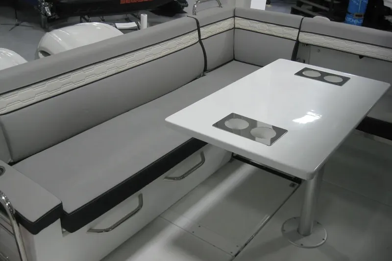 Slide: The Image of Interior of 2026 Jeanneau NC 895 Series 2 boat, featuring seating and table. - 13