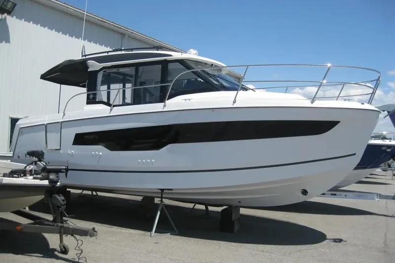 Slide: The Image of Interior of 2026 Jeanneau NC 895 Series 2, featuring a modern dining area with cushioned seating. - 17