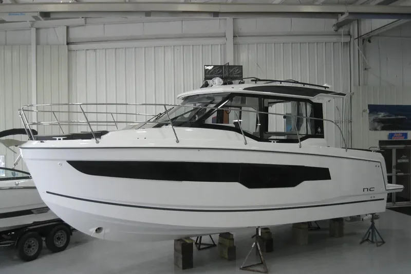 Slide: The Image of 2026 Jeanneau NC 895 Series 2 boat in showroom, front view. - 2