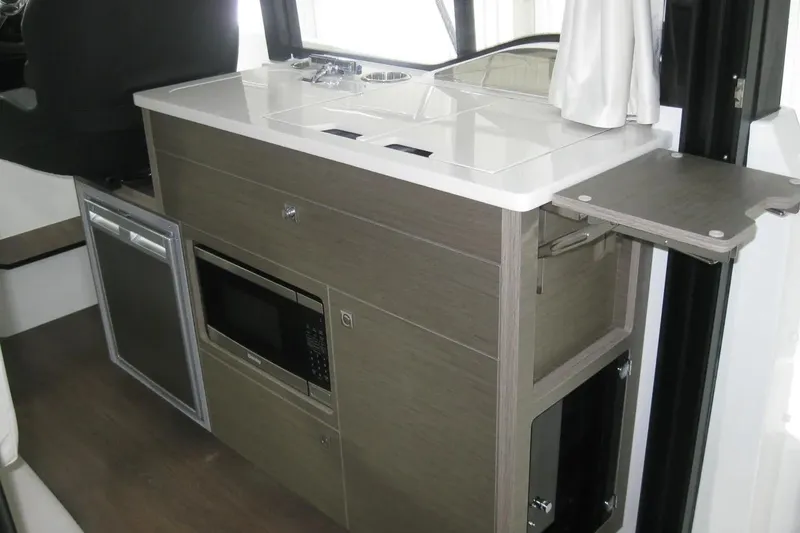 Slide: The Image of Interior cabin of 2026 Jeanneau NC 895 Series 2, featuring modern design and ambient lighting. - 33