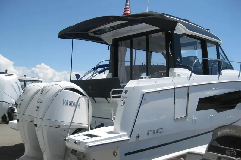 Slide: The Image of 2026 Jeanneau NC 895 Series 2 with dual Yamaha 250 V6 outboard engines in a showroom. - 4