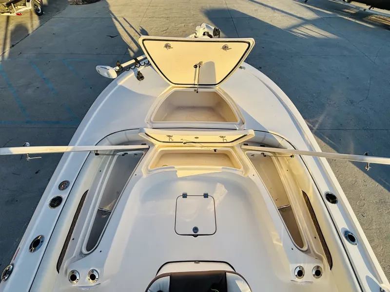 Slide: The Image of 2024 Tidewater Custom 22 Excursion CC boat deck with storage compartments. - 15