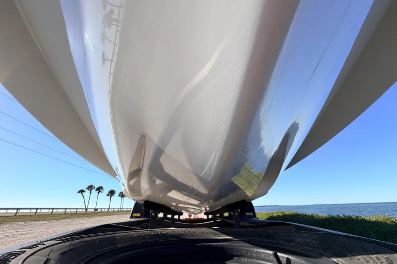 Slide: The Image of 2021 Chittum Skiffs Islamorada 18 hull on trailer, coastal background. - 11