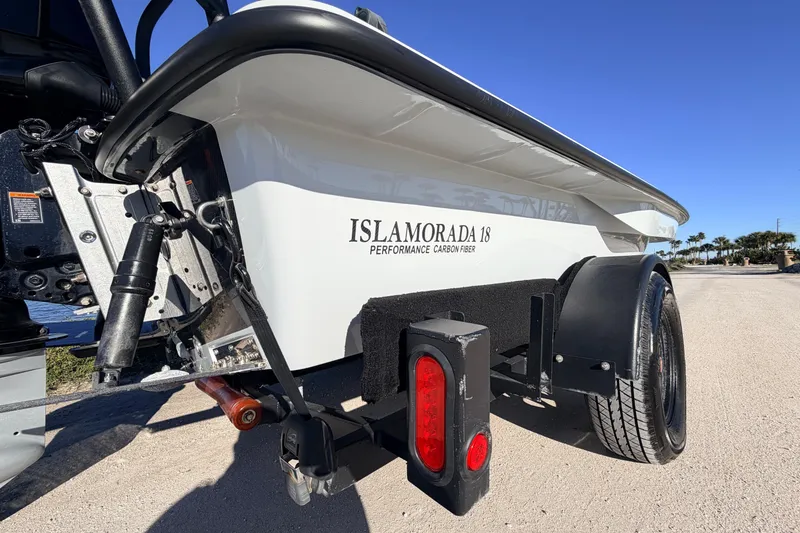 Slide: The Image of 2021 Chittum Skiffs Islamorada 18 boat on trailer, showcasing performance carbon fiber design. - 12