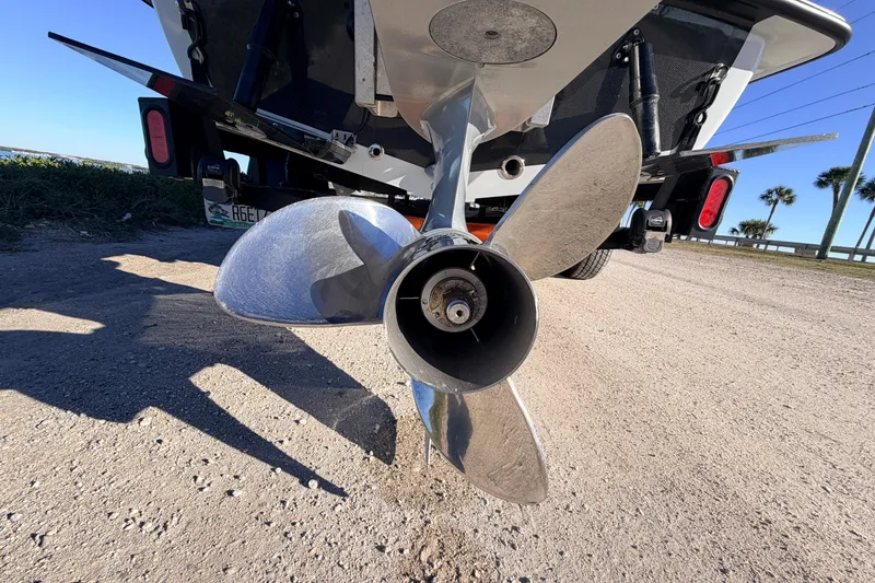 Slide: The Image of Propeller of 2021 Chittum Skiffs Islamorada 18 on a sandy surface. - 15