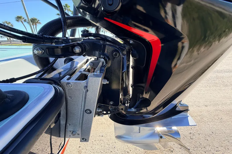 Slide: The Image of 2021 Chittum Skiffs Islamorada 18 outboard motor detail with sleek design and metallic finish. - 18