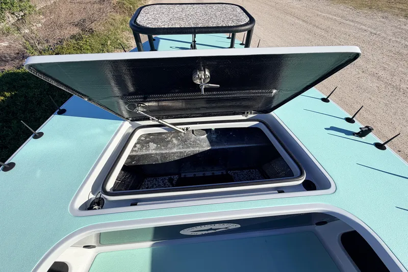 Slide: The Image of 2021 Chittum Skiffs Islamorada 18 with open storage compartment on deck. - 30