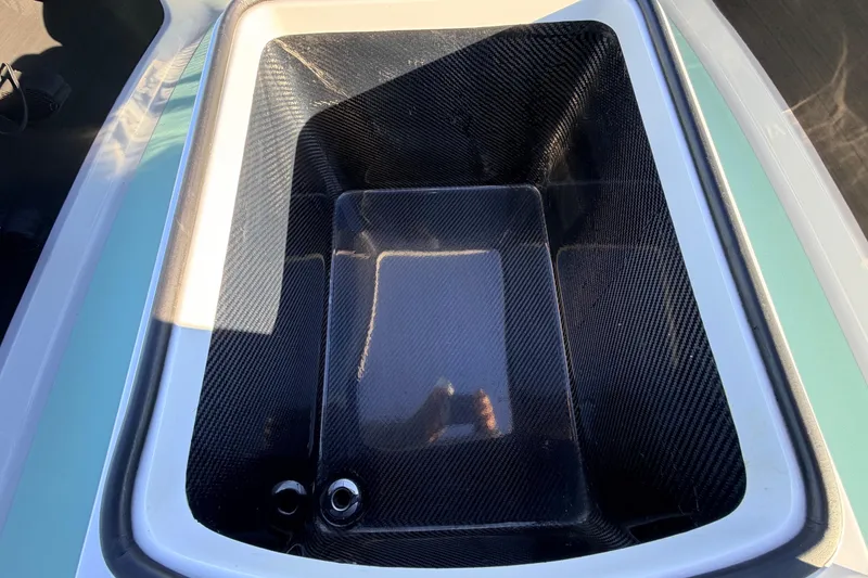 Slide: The Image of Carbon fiber compartment in 2021 Chittum Skiffs Islamorada 18 boat. - 41