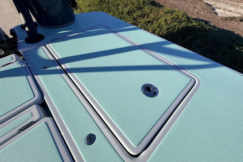 Slide: The Image of 2021 Chittum Skiffs Islamorada 18 deck with storage hatch and textured surface. - 60