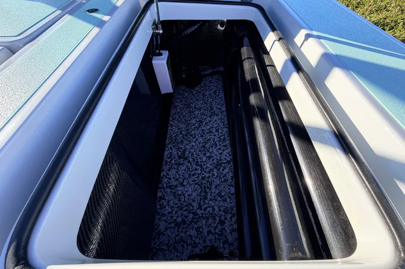 Slide: The Image of Storage compartment of 2021 Chittum Skiffs Islamorada 18, featuring spacious interior and sleek design. - 62
