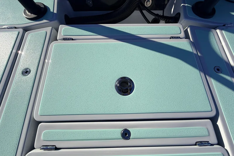 Slide: The Image of Chittum Skiffs Islamorada 18, 2021 model, featuring a mint green deck with storage hatch. - 65