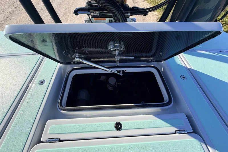 Slide: The Image of Open storage compartment on 2021 Chittum Skiffs Islamorada 18 boat, showcasing interior details. - 66