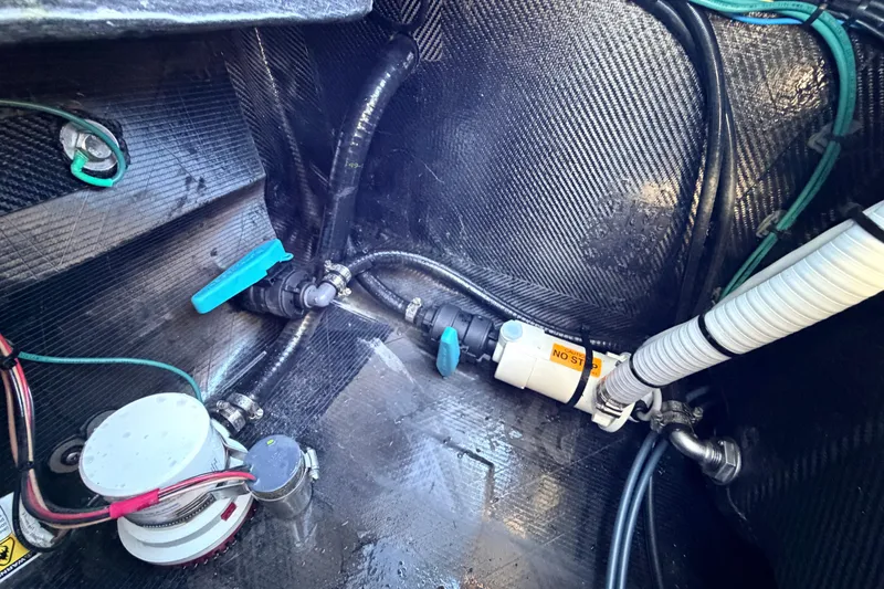 Slide: The Image of 2021 Chittum Skiffs Islamorada 18 interior showing bilge pump and wiring setup. - 70