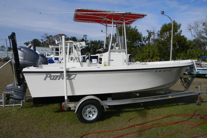 The Image of 2014 Parker 1801 Center Console boat on trailer with red canopy and Yamaha motor. - 0