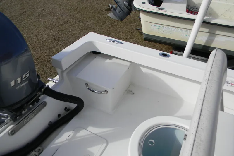 Slide: The Image of 2014 Parker 1801 Center Console boat with Yamaha 115 engine, featuring a clean deck layout. - 2