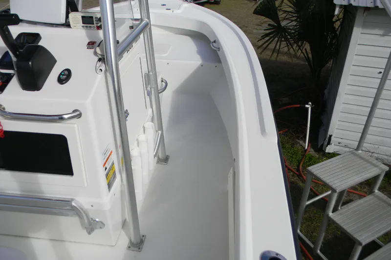 Slide: The Image of 2014 Parker 1801 Center Console boat interior with steering console and railing. - 5