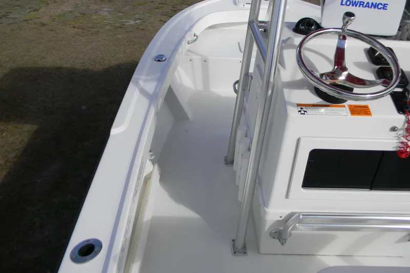 Slide: The Image of 2014 Parker 1801 Center Console boat interior with steering wheel and Lowrance equipment. - 6