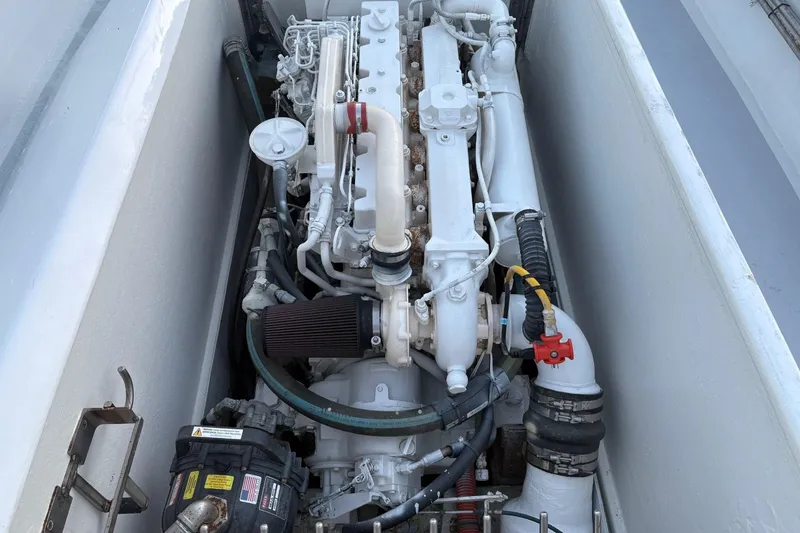 Slide: The Image of Engine compartment of a 1994 Custom Workboat, showcasing detailed mechanical components. - 10