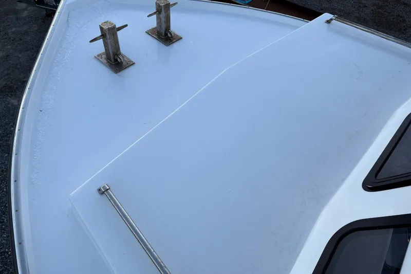 Slide: The Image of Bow of a 1994 Custom Workboat with cleats and windows. - 12