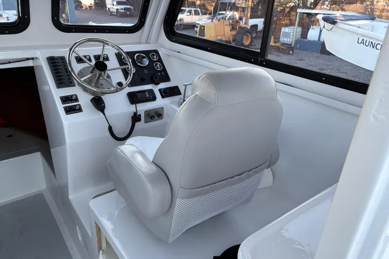 Slide: The Image of Interior of a 1994 Custom Workboat with steering wheel and control panel. - 14