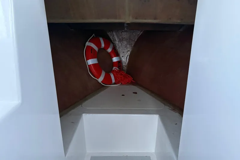 Slide: The Image of Interior of a 1994 Custom Workboat with a life ring stored inside. - 16