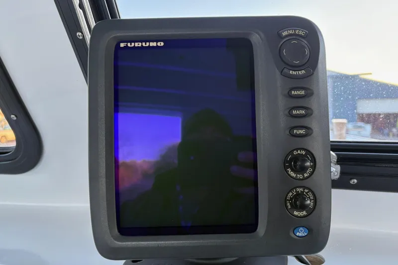 Slide: The Image of Furuno marine navigation display on a 1994 Custom Workboat, featuring control buttons and knobs. - 17