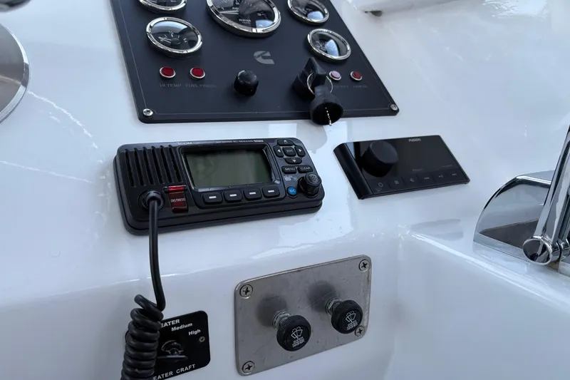 Slide: The Image of Control panel of a 1994 Custom Workboat with radio and gauges. - 19