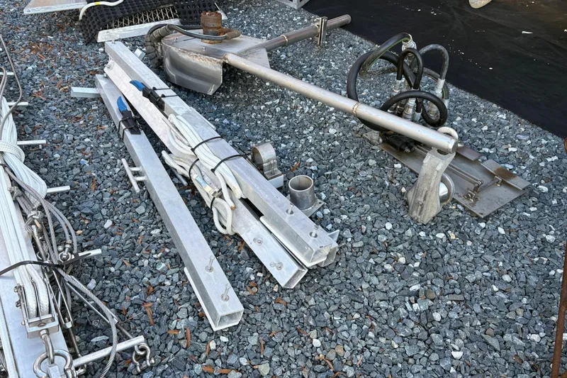 Slide: The Image of Metal components and cables on gravel, related to a 1994 Custom Workboat. - 20