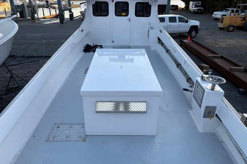 Slide: The Image of Custom 1994 workboat with spacious deck, control panel, and storage compartment. - 6