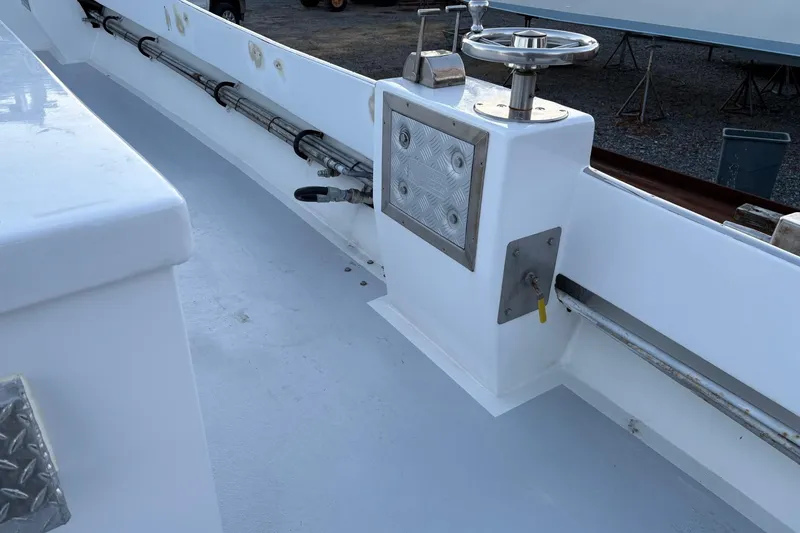 Slide: The Image of 1994 Custom Workboat deck with steering wheel and control panel. - 8