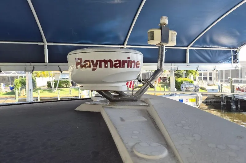 Slide: The Image of Raymarine radar on 2013 Azimut 36 yacht under blue canopy at marina. - 10