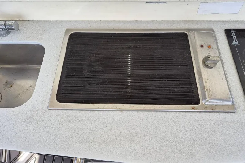 Slide: The Image of Kitchen area of a 2013 Azimut 36 yacht with stove and sink. - 12