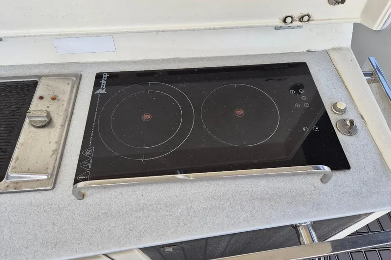 Slide: The Image of Induction cooktop on 2013 Azimut 36 yacht, featuring dual burners and sleek design. - 13