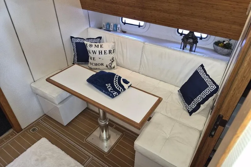 Slide: The Image of Interior of 2013 Azimut 36 yacht with cozy seating and nautical decor. - 16