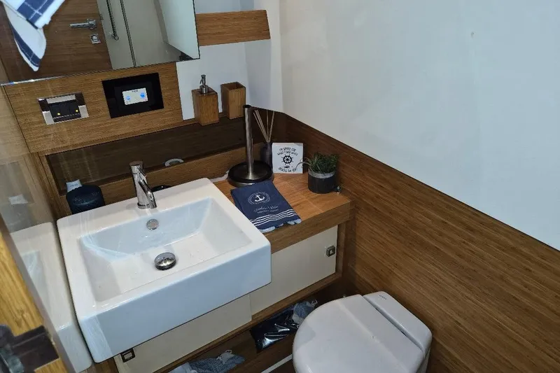 Slide: The Image of Bathroom interior of 2013 Azimut 36 yacht with modern sink and wooden accents. - 17