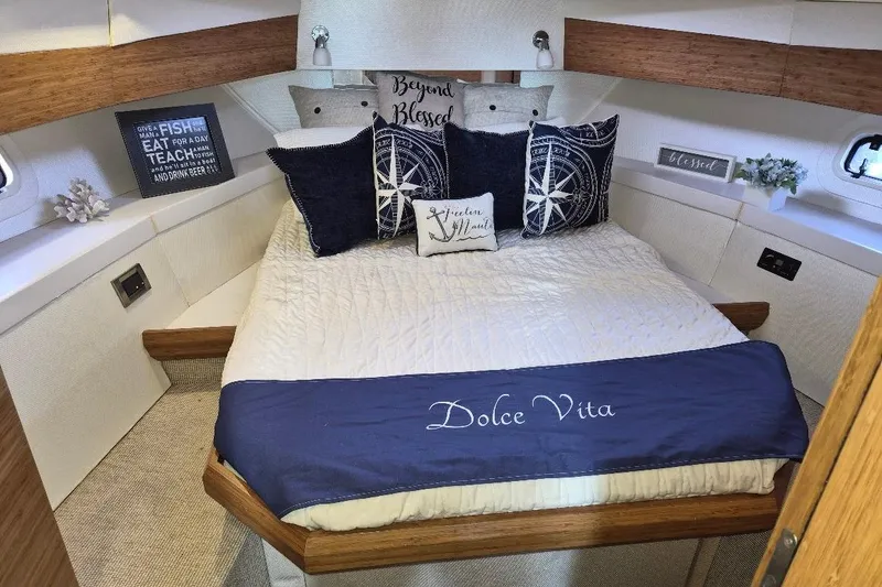 Slide: The Image of Luxurious bedroom interior of 2013 Azimut 36 yacht with nautical-themed decor. - 18